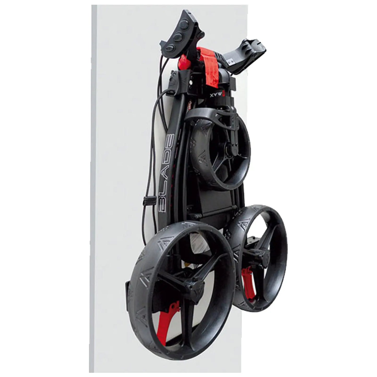 A compact golf pushcart is displayed in a folded position showcasing its three large wheels and handle. It is mounted against a wall, indicating a storage context.
