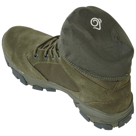 A green outdoor boot is positioned upright with a high, padded collar and textured bottom sole showcasing rugged tread designed for traction in various terrains.