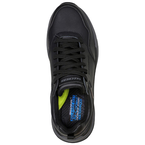 A black athletic shoe with a sturdy design sits upright. It features black laces and a branded tongue, surrounded by a simple background, emphasizing its waterproof and comfort qualities.