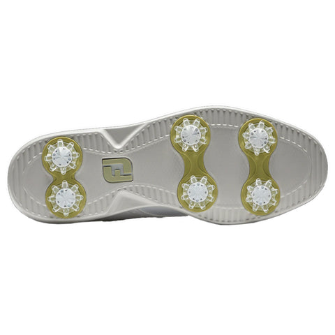A golf shoe sole is depicted featuring six translucent cleats arranged in pairs with a prominent logo in the center of the sole highlighting its design for traction on grass surfaces.