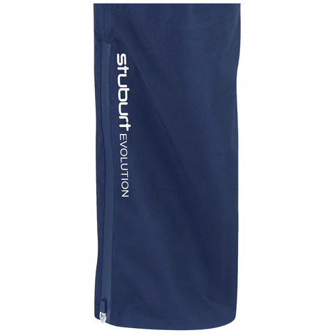 A navy-blue sports garment stands upright featuring a zipper on one side and the text "stuburt EVOLUTION" printed in white along the length, suggesting a stylish, athletic design.