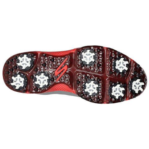 Red and black athletic shoe sole features a unique pattern with six prominent white stud-like structures designed for traction on grass or turf surfaces. The branding includes a red 'S' logo.