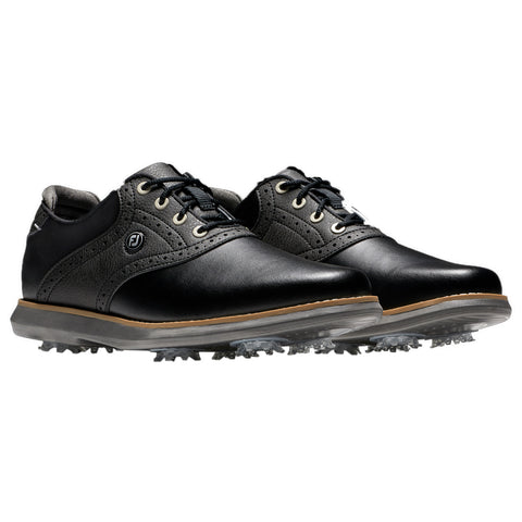 Black leather golf shoes are displayed with a shiny finish and a flexible sole featuring spiked traction. They have a classic design with laces and contrasting gray accents.