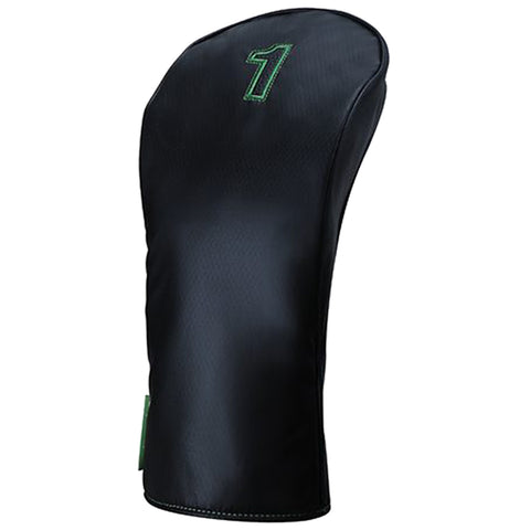 A black golf club head cover is standing upright with a number one stitched in green on the front, designed to protect a driver from damage when not in use.