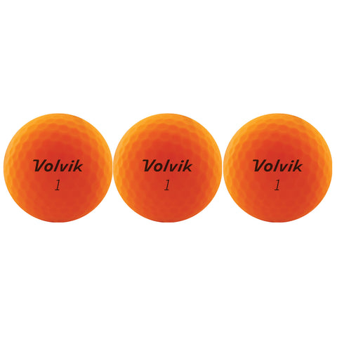 Three bright orange golf balls are arranged in a row displaying the name "Volvik" and the number "1" on their surface showcasing their dimpled texture and vibrant color against a plain background