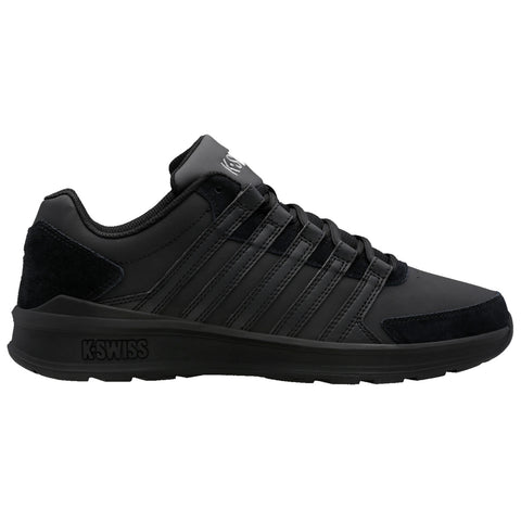 Black athletic shoe features a sleek design with multiple stripes and a cushioned sole positioned on a white background showcasing durability and style in footwear.