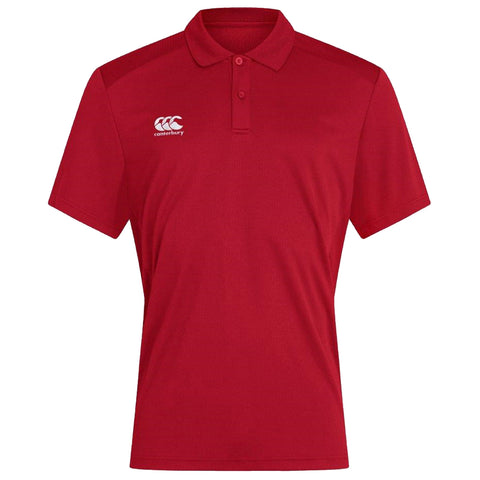 A red polo shirt is displayed upright showcasing a collar and short sleeves featuring a logo on the left side indicating the brand Canterbury. The background is plain.