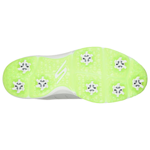 A shoe sole designed for athletic use displays six traction studs on a vibrant green bottom with a textured surface ensuring grip on grass or turf during play.