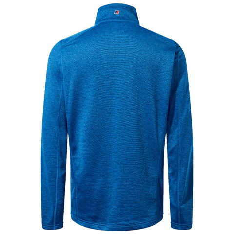 A blue long-sleeved shirt displays a textured fabric pattern with a high collar and a small logo at the back near the neck in a simple backdrop.