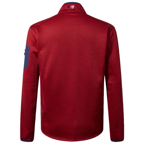 A red long-sleeved jacket hangs facing away with a high collar and features a dark blue patch on one sleeve, set against a neutral background.
