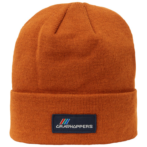 An orange knit beanie sits upright showcasing a folded brim and a brand label at the front with the word CRAGHOPPERS in white letters against a dark background.