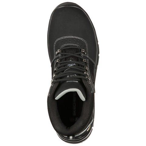 A black hiking boot with laces and metal eyelets is positioned upright against a plain background showcasing features like stitching and a branded insole.
