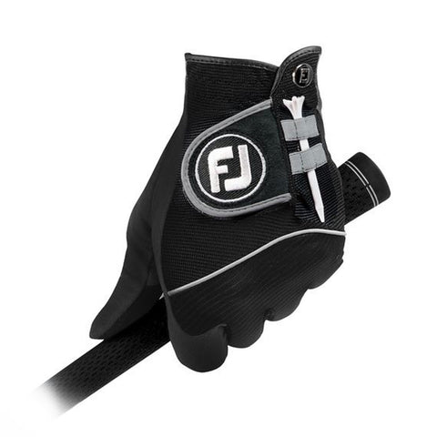 A black golf glove grips the handle of a golf club with a white tee secured on the glove highlighting its functional design for improving grip and performance during play.