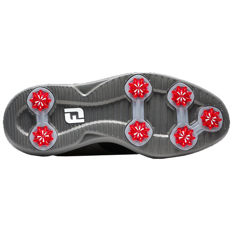 Black leather golf shoes are displayed side by side featuring a classic design with a low profile and spiked soles suitable for traction on the golf course.