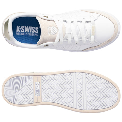 A white K-Swiss sneaker is displayed with laces and a blue insole reading K-SWISS WEARING IS BELIEVING. The bottom shows a textured sole with the K-SWISS logo.