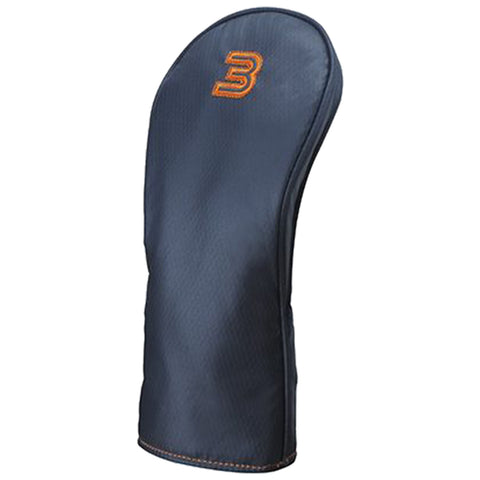 A navy golf club headcover stands upright showcasing its sleek design with a prominent orange logo the headcover protects the club from damage when not in use