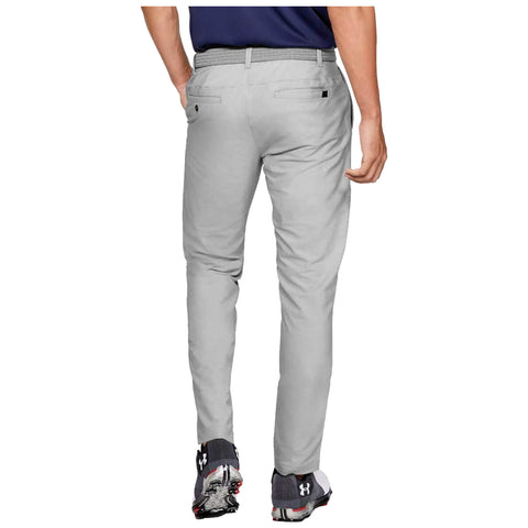 Gray pants are worn by a person standing with their back facing the viewer. The individual has one hand on their hip, and they are on a plain background.