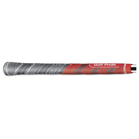 A golf grip in red and gray is lying horizontally with textured patterns for enhanced grip. The branding "Golf Pride" is visible, indicating its intended use for golfing.