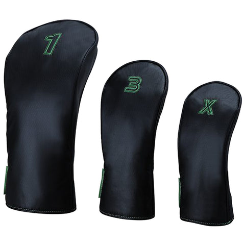 Three golf club headcovers are displayed in varying sizes with numbers 1 B and X stitched in green on a black leather background designed to protect the clubs from damage.