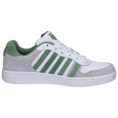 A pair of athletic sneakers features a light green and white design with suede and textured materials. They are positioned upright against a neutral background, showcasing both the front and back views.