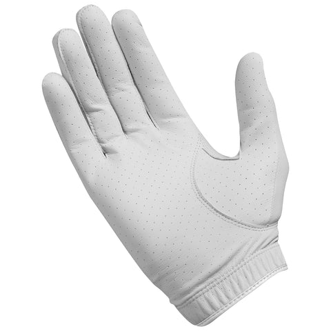 A white golf glove is displayed with fingers extended showcasing a smooth leather texture and perforated design for breathability in a neutral background.