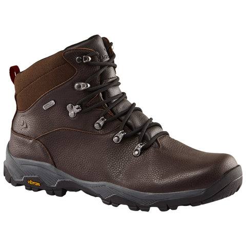 Brown hiking boot features sturdy laces and metal eyelets with a textured finish designed for outdoor activities amidst rugged terrains and varying weather conditions. Quality rubber sole enhances grip and durability.