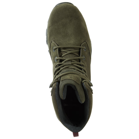 A green hiking boot displays a textured upper with laces tightly secured revealing an interior lined with fabric set against a neutral background emphasizing its rugged design and purpose.