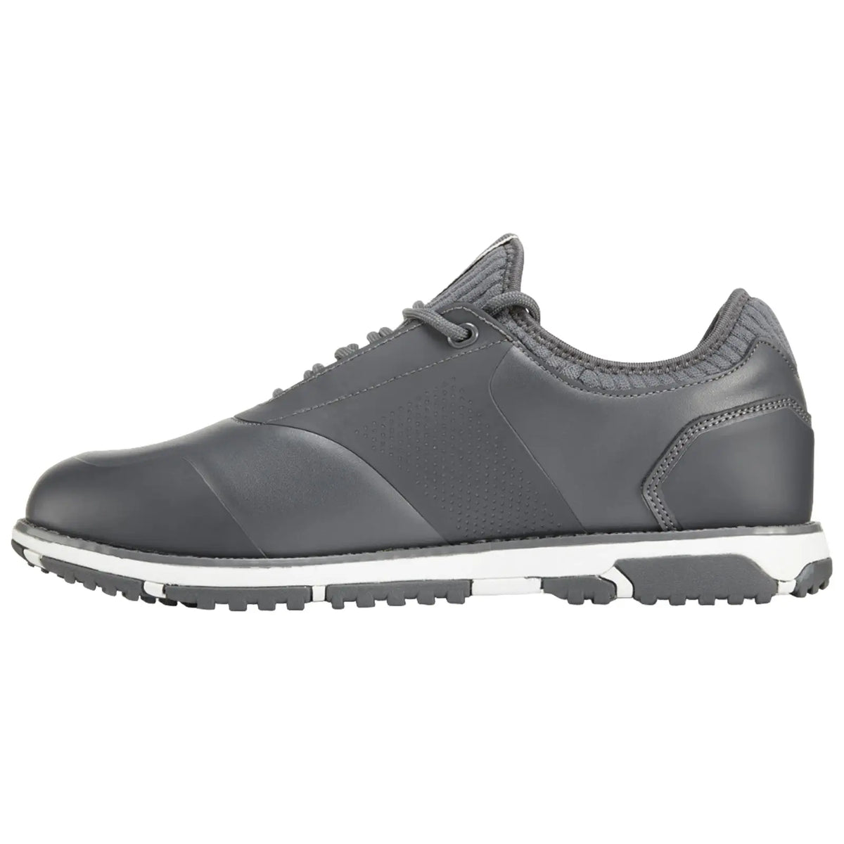 A gray athletic shoe sits on a flat surface featuring a smooth leather upper and textured accents with a white midsole and a patterned rubber outsole designed for traction.