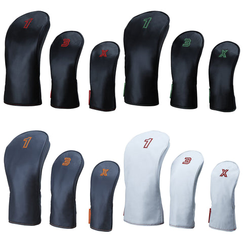 A collection of golf club headcovers in various sizes displays numbers and letters on them The headcovers are arranged in two rows with different color variations and designs for identification