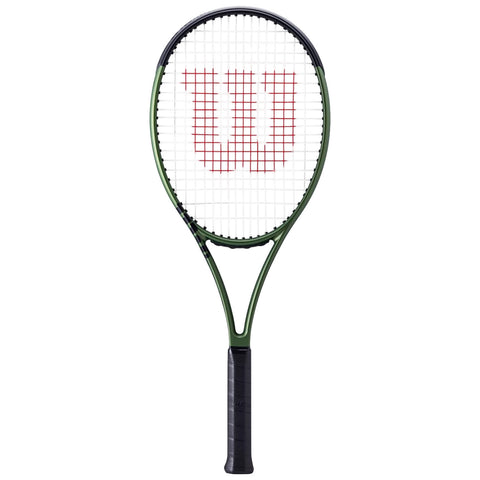 A tennis racket is displayed upright with a black handle and green frame showcasing a red Wilson logo near the center of its white stringed head.