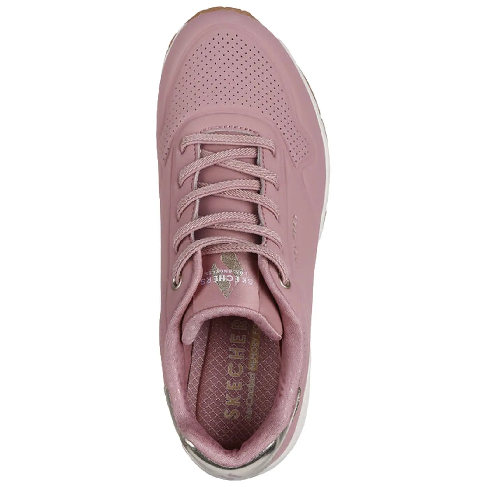 A pink sneaker with a smooth surface and perforated details features a lace-up design. The interior shows a cushioned insole labeled SKECHERS, designed for comfort andstyle.