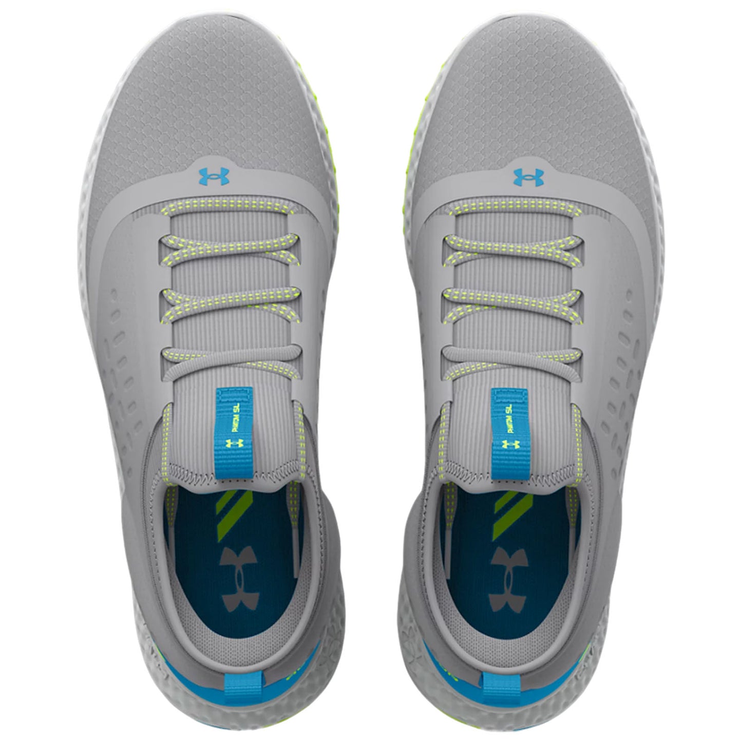 Gray athletic shoes are positioned on a flat surface laces are threaded through eyelets and the tongue features a blue tab with branding the interior shows contrasting colors and logo.