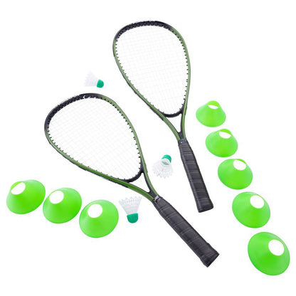 Two badminton rackets lie parallel with several green cones and shuttlecocks arranged around them in a bright setting suggesting a playful sports environment.
