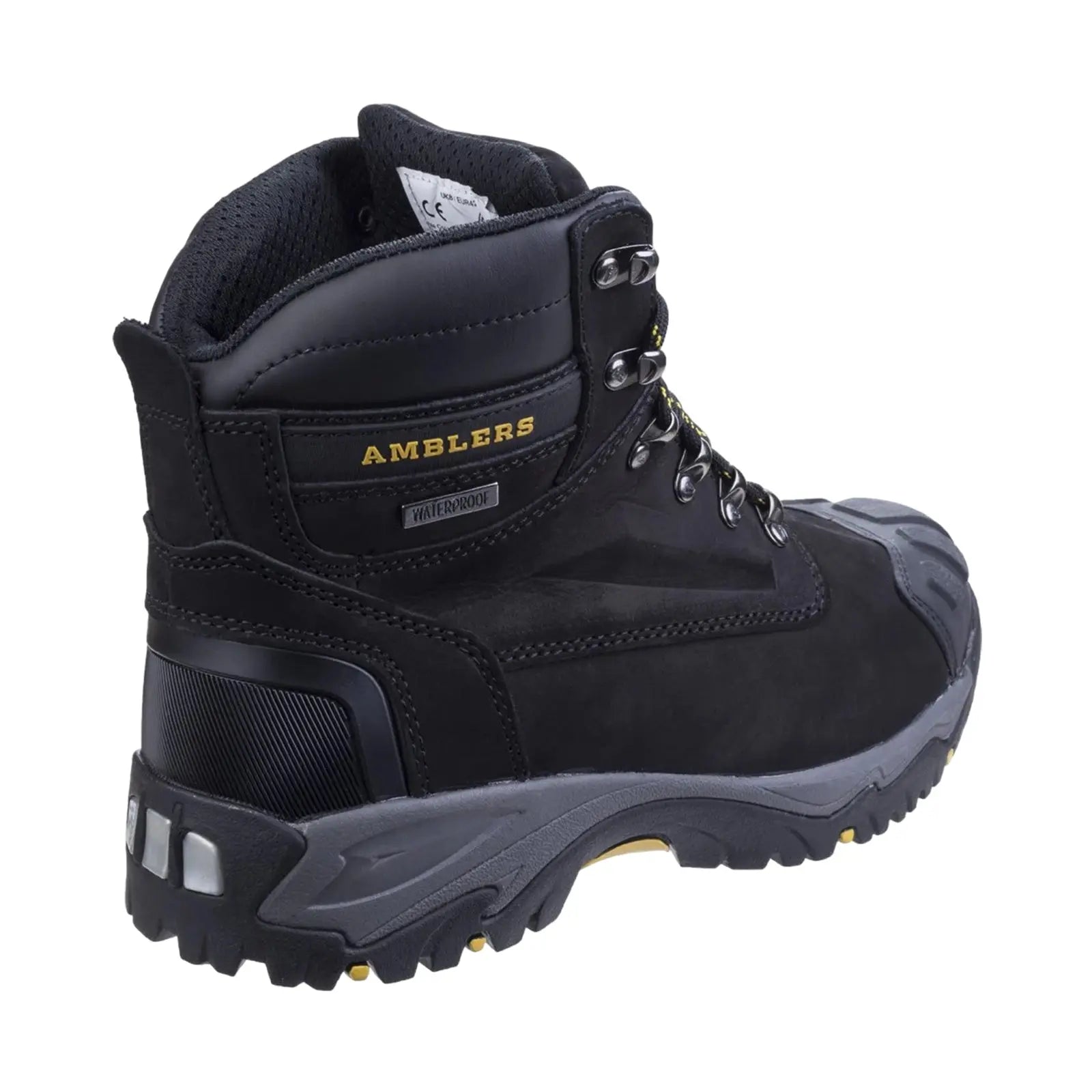 A black waterproof hiking boot stands upright showcasing metal eyelets and a rugged sole designed for traction in outdoor settings. The brand name AMBLERS is prominently displayed on the side.