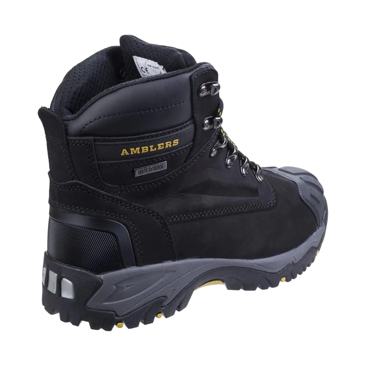 A black waterproof hiking boot stands upright showcasing metal eyelets and a rugged sole designed for traction in outdoor settings. The brand name AMBLERS is prominently displayed on the side.