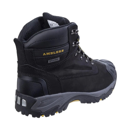 A black waterproof hiking boot stands upright showcasing metal eyelets and a rugged sole designed for traction in outdoor settings. The brand name AMBLERS is prominently displayed on the side.