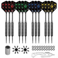 A set of ten darts with colorful flight designs in red, green, blue, and yellow stands upright next to additional accessories like a dart tool, ring sets, and flight protectors on a plain surface.