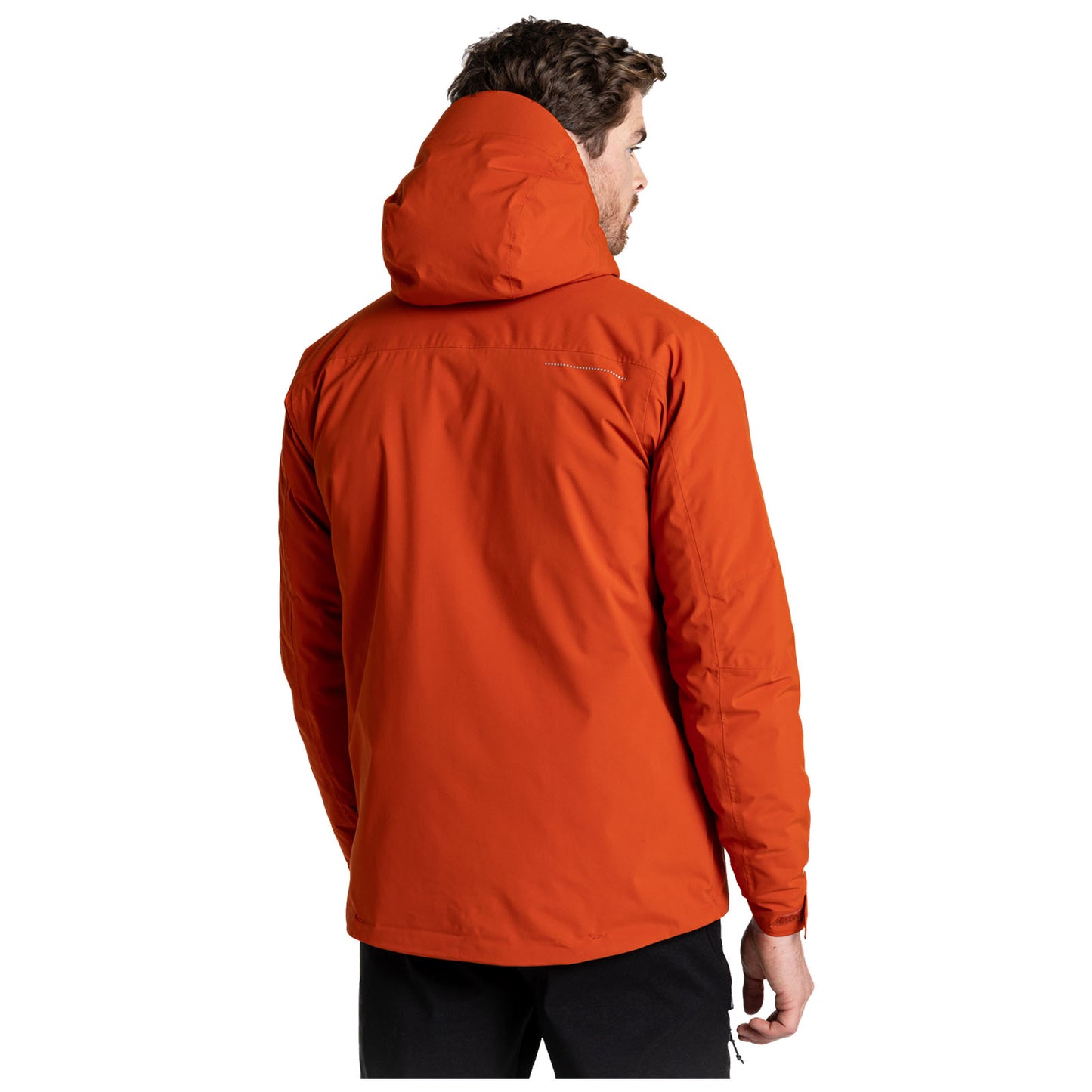 A person is wearing an orange jacket with a hood facing away from the viewer in a plain white background suggesting a focused product display.