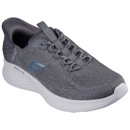A gray athletic shoe is shown resting on a flat surface featuring a textured upper with laces and a cushioned sole designed for comfort and support during physical activities.