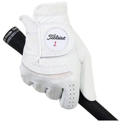A white golf glove is gripping a black golf club shaft the glove features a circular patch with the Titleist logo and the number one in red the background is plain and neutral