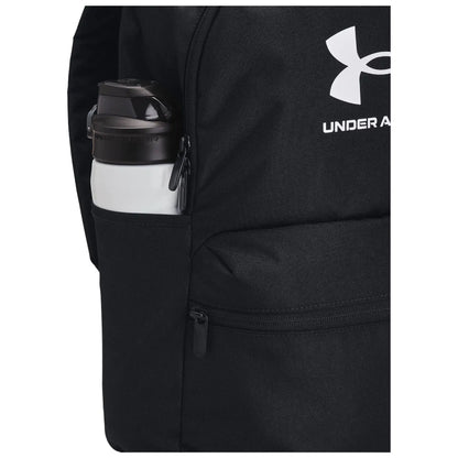 A black backpack features a side pocket holding a white water bottle with a dark cap showcasing the Under Armour logo the backpack is designed for sporty use and convenience.