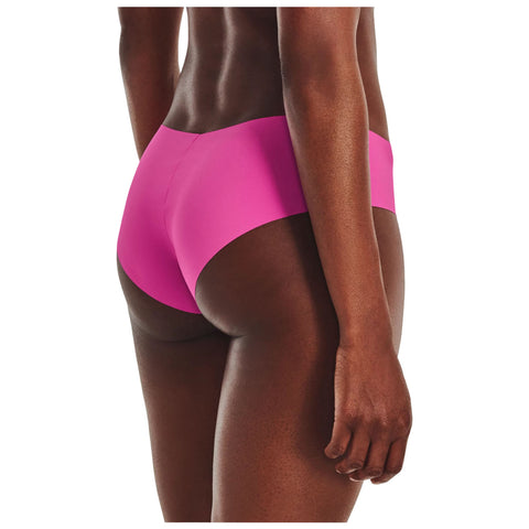A person is positioned sideways wearing pink hipster underwear showcasing their back side against a plain white background highlighting the underwear design and skin tone.