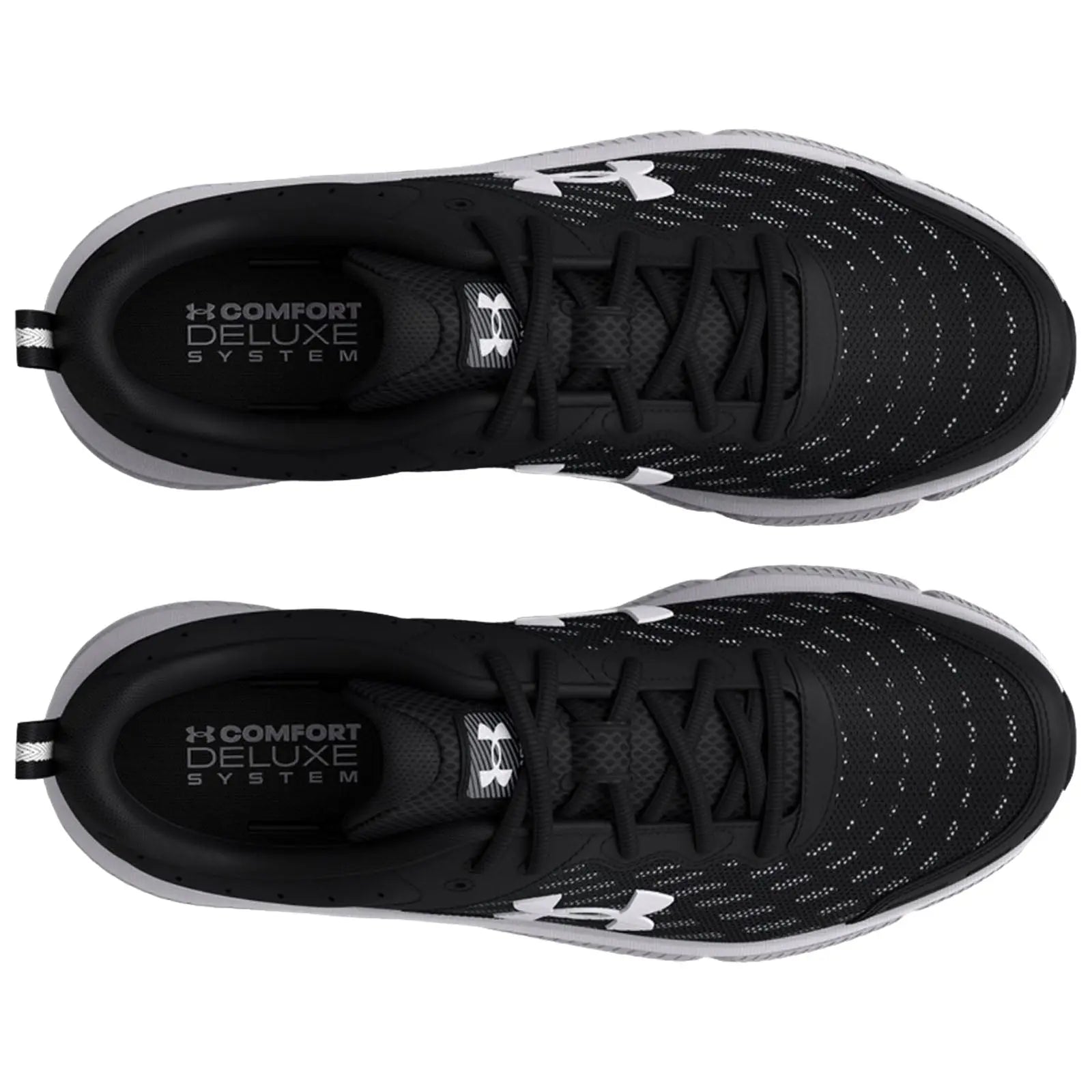 Black athletic shoes are positioned with the tops facing up showcasing a sleek design and perforated upper material with white logo details and text reading COMFORT DELUXE SYSTEM inside the shoes