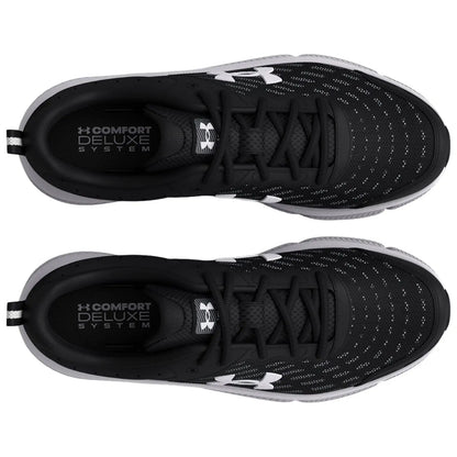 Black athletic shoes are positioned with the tops facing up showcasing a sleek design and perforated upper material with white logo details and text reading COMFORT DELUXE SYSTEM inside the shoes