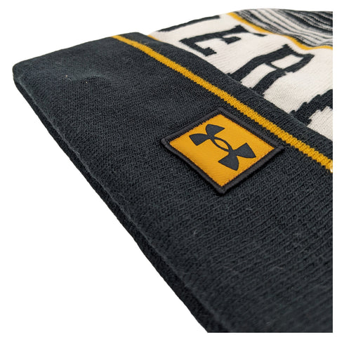 A beanie hat is positioned at an angle displaying its fabric texture and a visible logo emblem the design includes a yellow and black color scheme with a striped pattern.
