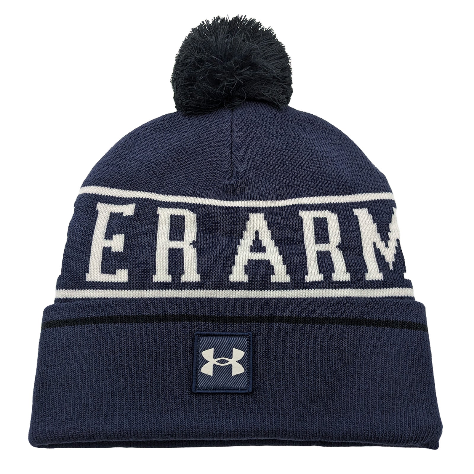 A dark navy beanie hat with a white stripe features the word "ARMOUR" prominently displayed. It has a black pom-pom on top and displays an Under Armour logo on the front.