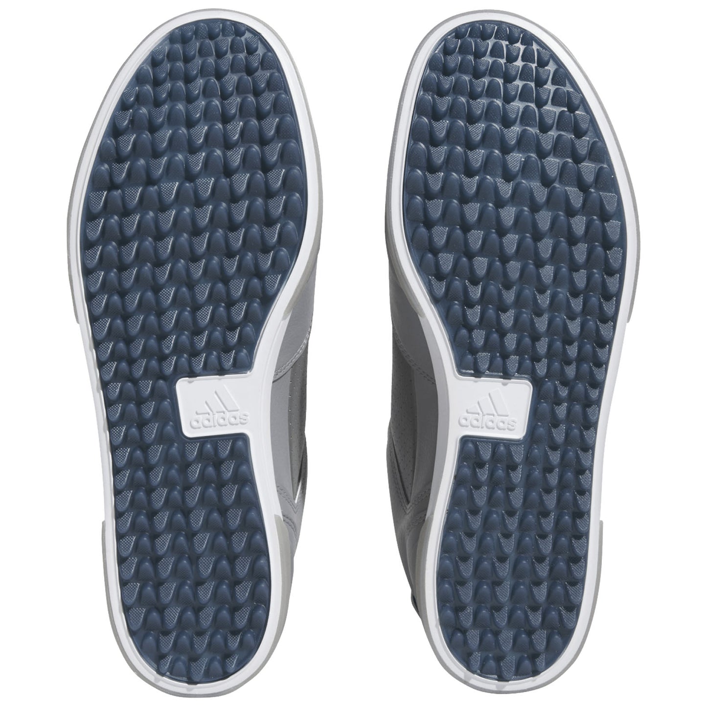 Two athletic shoes are displayed with their soles facing up showcasing a textured pattern for grip the shoes are designed for sports or casual wear and feature a logo on the sole