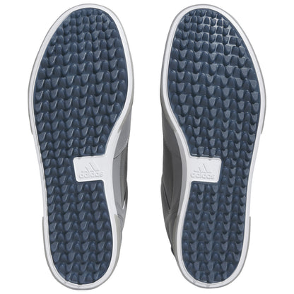 Two athletic shoes are displayed with their soles facing up showcasing a textured pattern for grip the shoes are designed for sports or casual wear and feature a logo on the sole