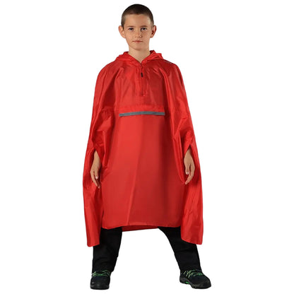 A child stands confidently wearing a bright red rain poncho with a hood and a front pocket in a neutral setting showcasing the outerwear designed for wet conditions.
