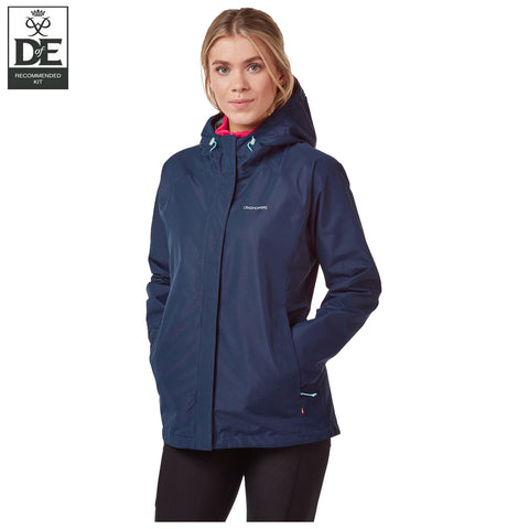 A woman stands wearing a dark blue hooded jacket with her hands in pockets and a slight smile, set against a plain white background, emphasizing the jacket's design. Recommended Kit logo in the corner.